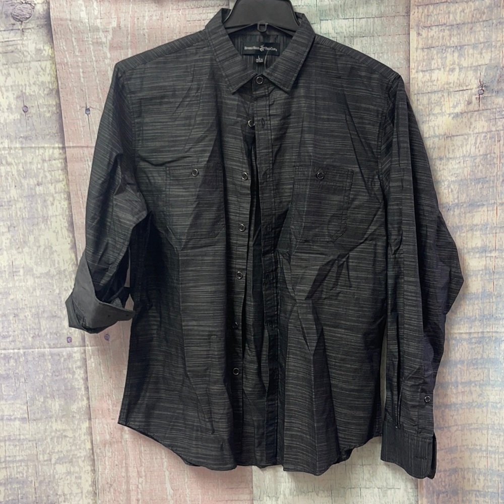 - Brand new with out tags men’s button down shirt.
